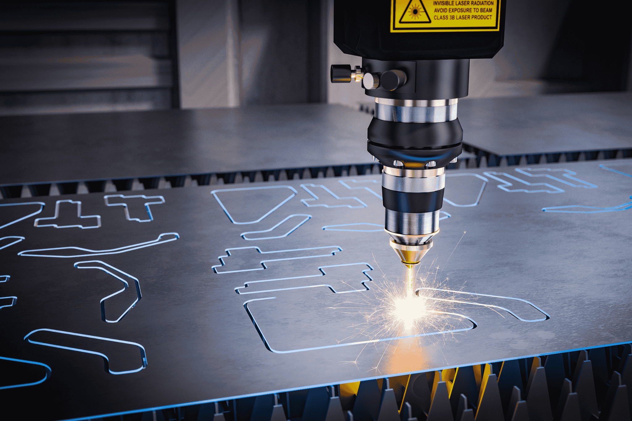Close-up of a CNC laser cutting machine sparking as it cuts precise shapes into a metal sheet