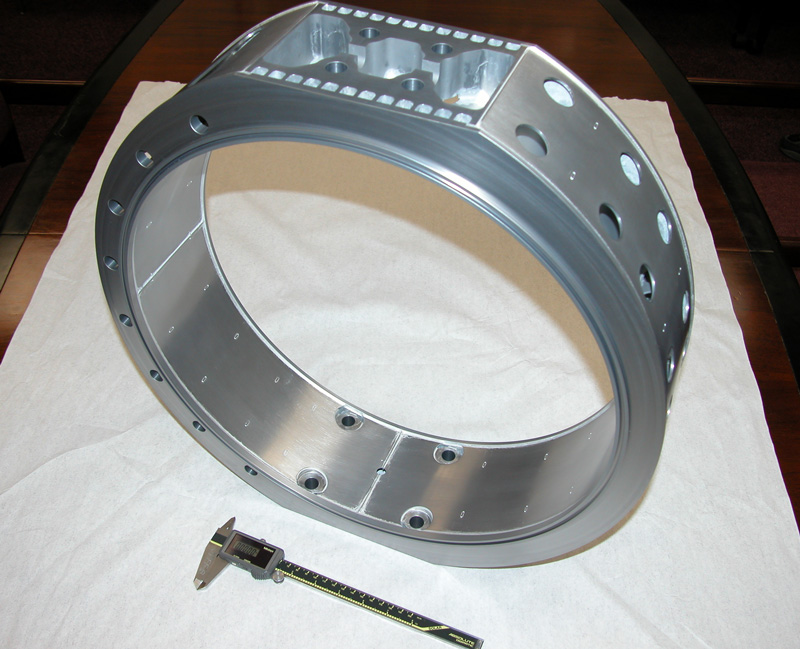 Complex brazed metal ring assembly with evenly spaced precision drilled holes